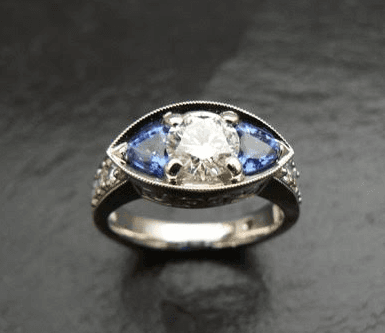 Custom sapphire and diamond engagement wedding ring with filigree