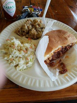 Chopped beef with dirty rice and cole slaw as sides