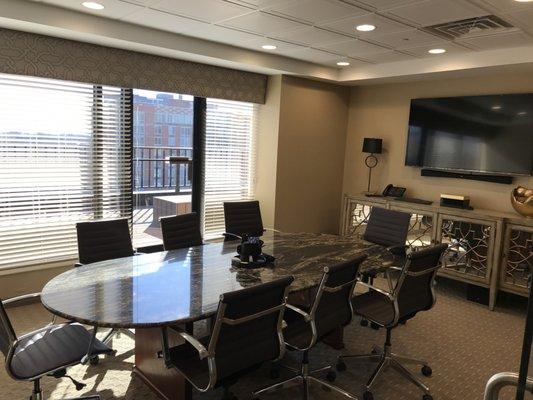 Our spacious conference room provides top of the line technology and a comfortable environment for meetings and closings.