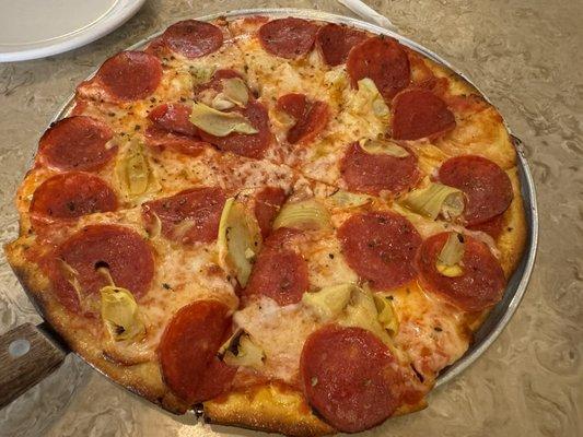 Pepperoni and artichoke pizza