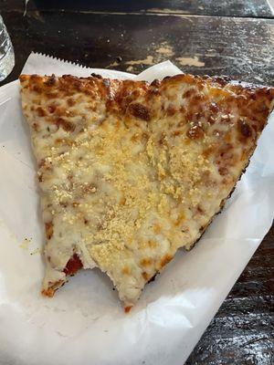 Cheese Slice Pup with Parmesan Cheese on top.