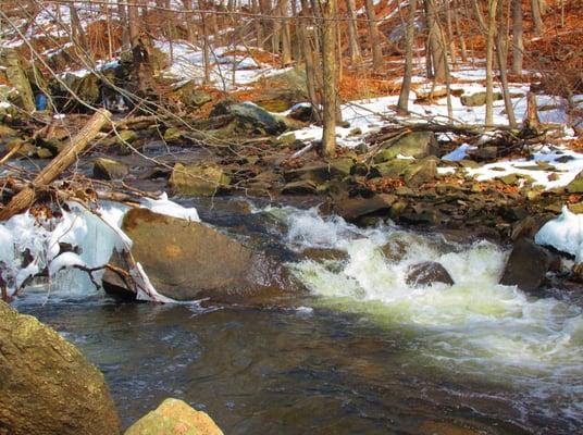 The stream next to the dam