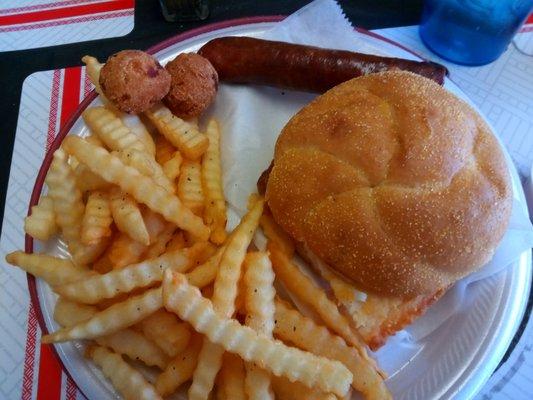 Catfish sandwich w fries and a hotlink.