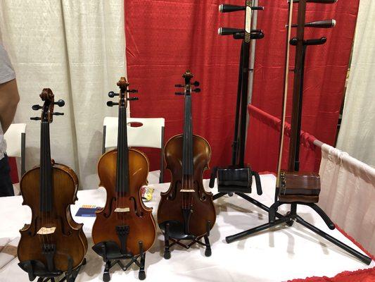 different size violins and Chinese erhu- 2 string fiddle