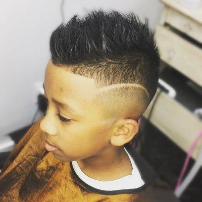 Medium high Bald fade , Texture Scissor Trim on Top and Design Line