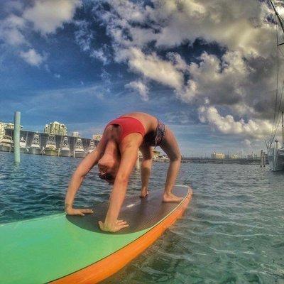 The owner, Carissa, practicing SUP yoga in Puerto Rico.