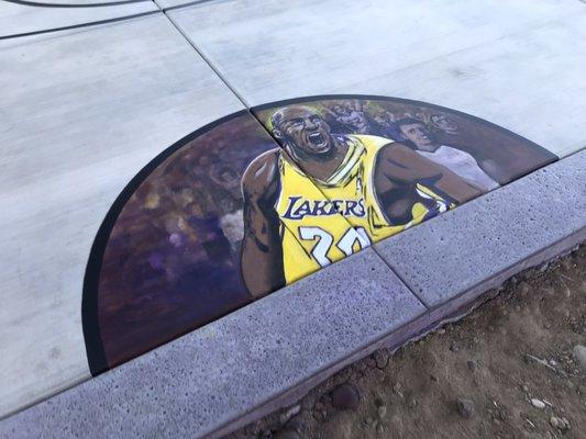 Kobe mural on concrete and stained the boarder purple.