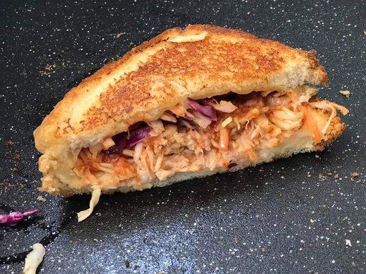 One of our specials, bbq pulled chicken with coleslaw with a slice of havarty and a slice of muenster cheese.