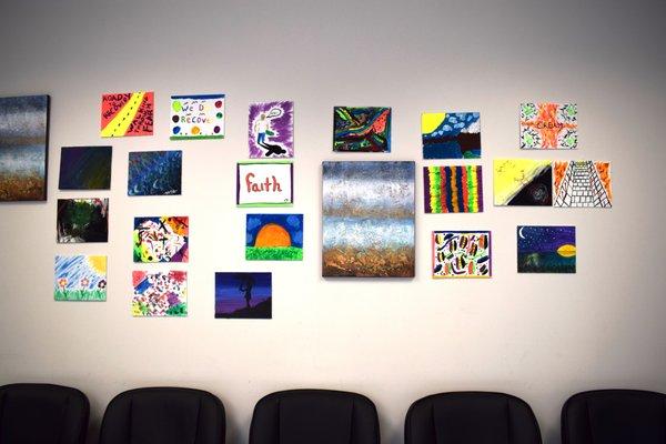 Client artwork on wall in group therapy room