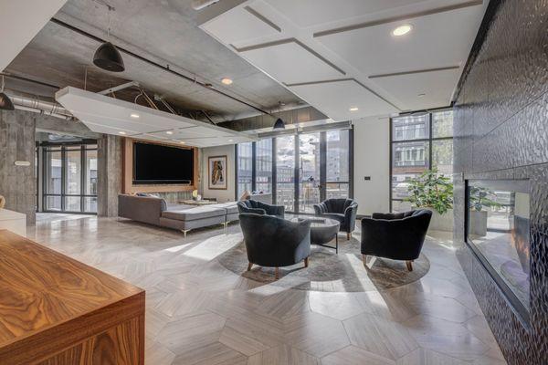 Lounge area with a fireplace and TV