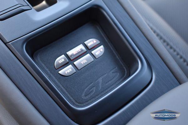 Escort controller in a fabricated trim panel for a Porsche 911.