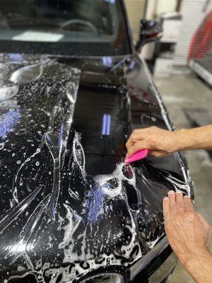 During installing of XPEL Ultimate Plus clear bra paint protection film on Rivian R1T by Sticker City.