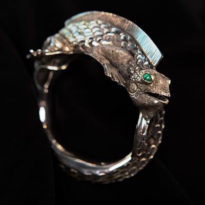 Unique animal jewelry is available at Glassando! This lizard bracelet is made from sterling silver with a malachite stone eye!