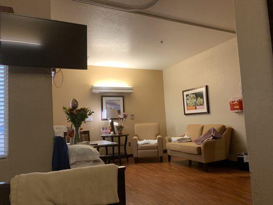 Single room, 1 Bed with Dresser and Nightstand and then  this living area, with a spacious bathroom.