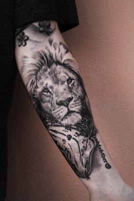 Black and grey realism Lion portrait with Dali Clock.