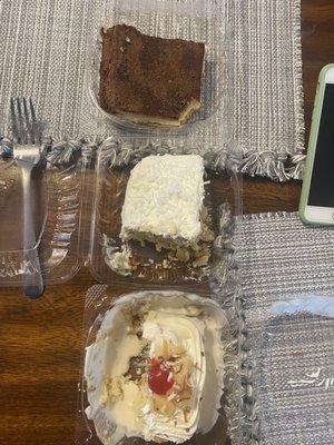 Churro cheesecake (on top), coconut cake (middle), and pina colada tres leches (bottom) all soo amazing!