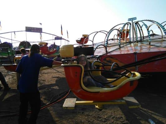 Here's my neice & son on the ride & the guy standing next to them is the guy who spun them & laughed with the guy controlling it