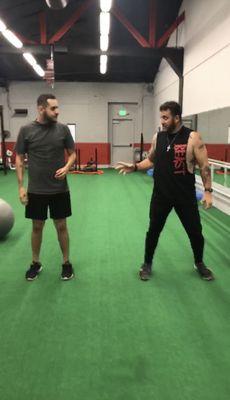 Coach Luis guiding me on a one on one post training session