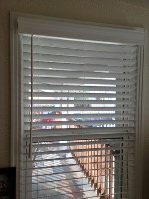 Close-up of blinds and valance.