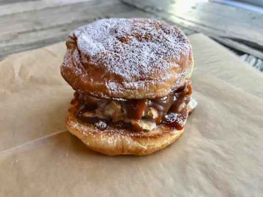 ice cream sandwich, vanilla Ice cream rolled in cinnamon toast crunch, warm caramel drizzle on a buttered-sugared grilled Kings Hawaiian bun