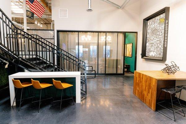 Conference room with sliding door opening up to the kitchen for catering and event space