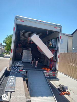 Mike Smith . Bringing in a few of the customers items into the back of the truck.