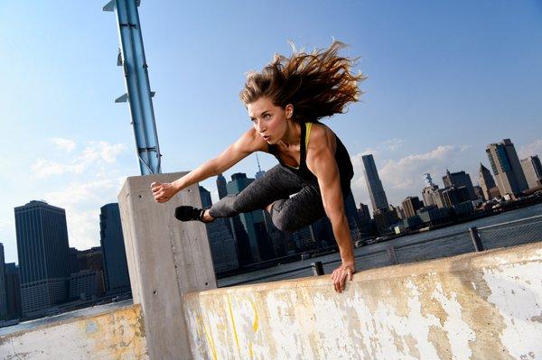 Coach Nikkie demonstrating a speed vault. Photo by Joe McNally for Nikon.