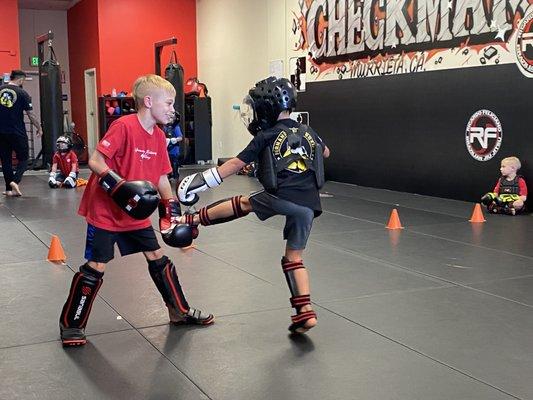 Live sparring in class.