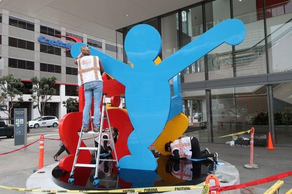 Public Art Conservation - cleaning and in-painting Keith Haring sculpture