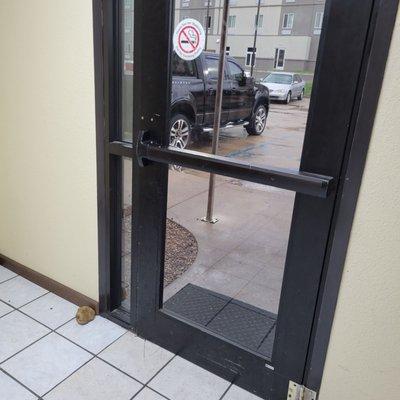 This is a push bar on a pull door that doesn't lock.