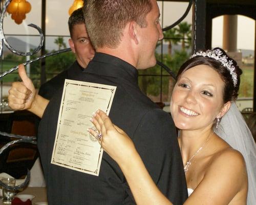 Happy bride with her wedding license.  Musical entertainment provided by Desert Music Entertainment.