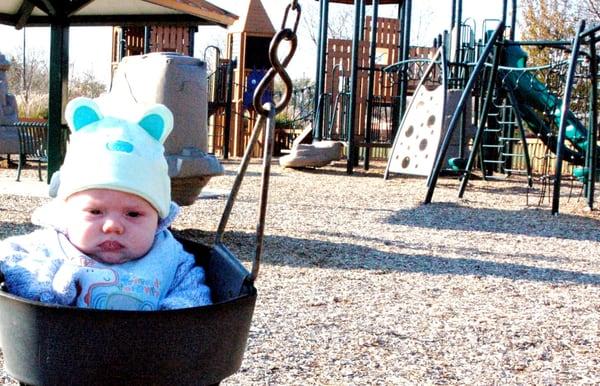 Westerville Planet Park; viewing playground equipment from swingset.  My gson has enjoyed this park since he was 2 months old.