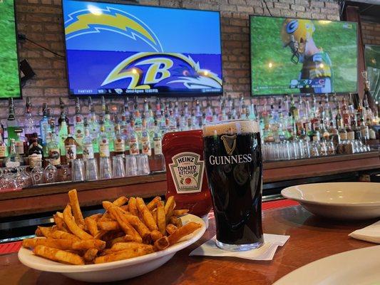 Three-dollar side of fries and a Guinness.