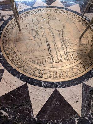 Love the wear on this brass floor medallion. Almost 100 years of foot traffic.