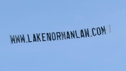 The firm flew a banner over the town!