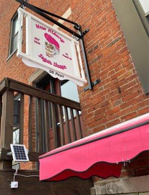 Look for the PINK awning.