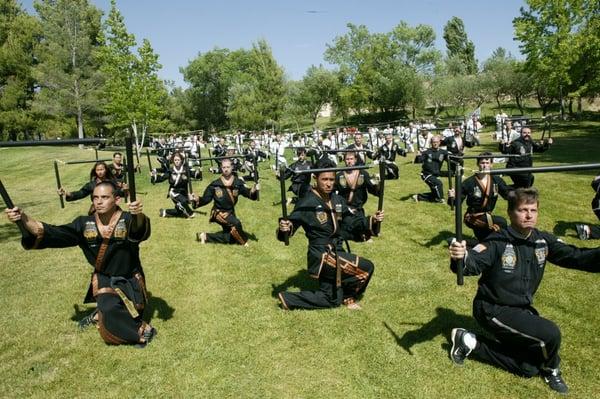 Instructors and Students Practicing Sam Chok Chu Chuck Bong (Three Section Staff)