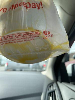 Butter at the bottom of my to go bag, my corn was drowned in butter causing it to overflow into my to go bag.