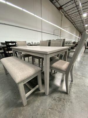 6pc dining set. Beautiful beige/gray table with beige fabric cushion chairs and bench.