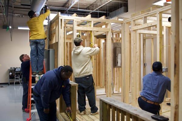 Students wiring Total Tech's state-of-the-art electrical training units in the Electrical Fundamentals class.