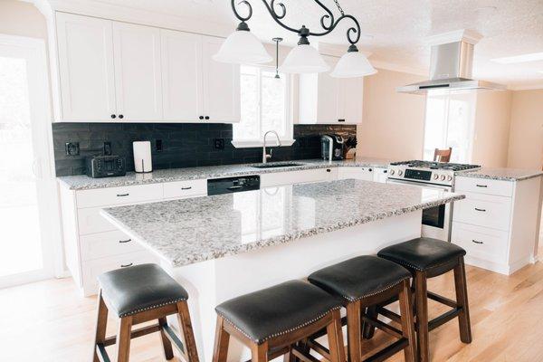 We knocked out walls to open up this kitchen and provide lots of seating for family get-togethers.