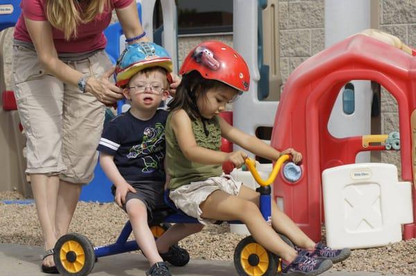 Preschool friends at TLC get ready for a ride together.