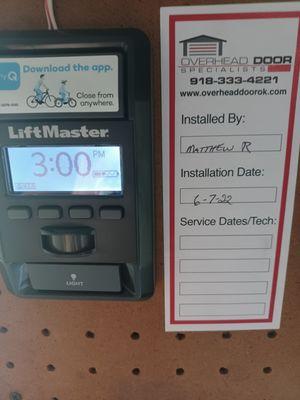 New garage door opener controller with Overhead Door Specialists contact info