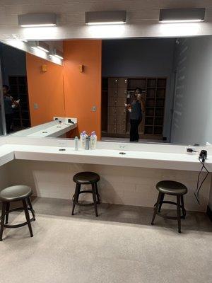 Well lit dressing area in the back.