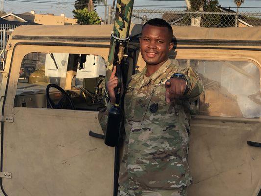 SSG Tucker manning the t-shirt cannon at Gardena HS homecoming parade