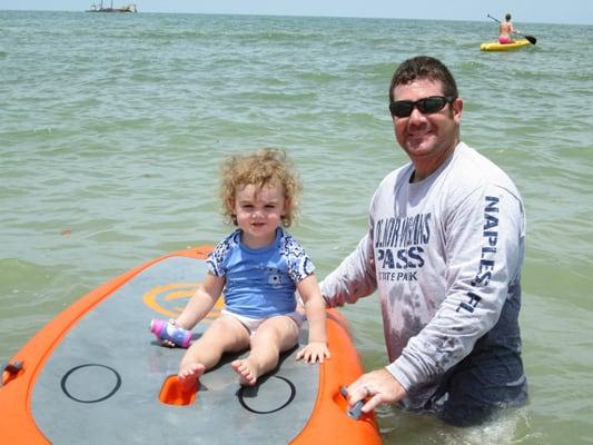 L getting her first paddle board lesson, i think she has got a great future