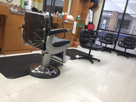 See the small non-barber chair? That's where they cut your hair