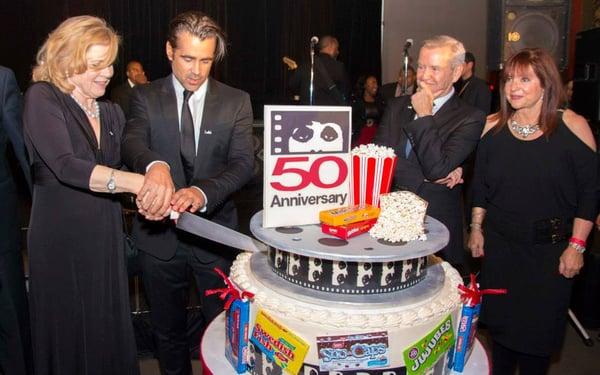 Colin Farrell and Liv Ullman cut the cake at the 50th Opening Night Reception. Photo by Timothy M. Schmidt.