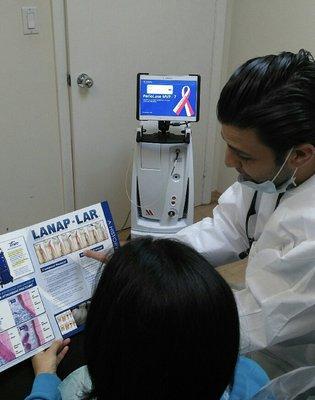 Dr. David explaining the LANAP Laser procedure to a patient