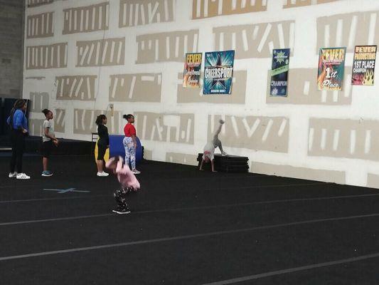 Level one tumbling perfecting their skills. Straight legs and strong arms for cheer and dance moves in their performances